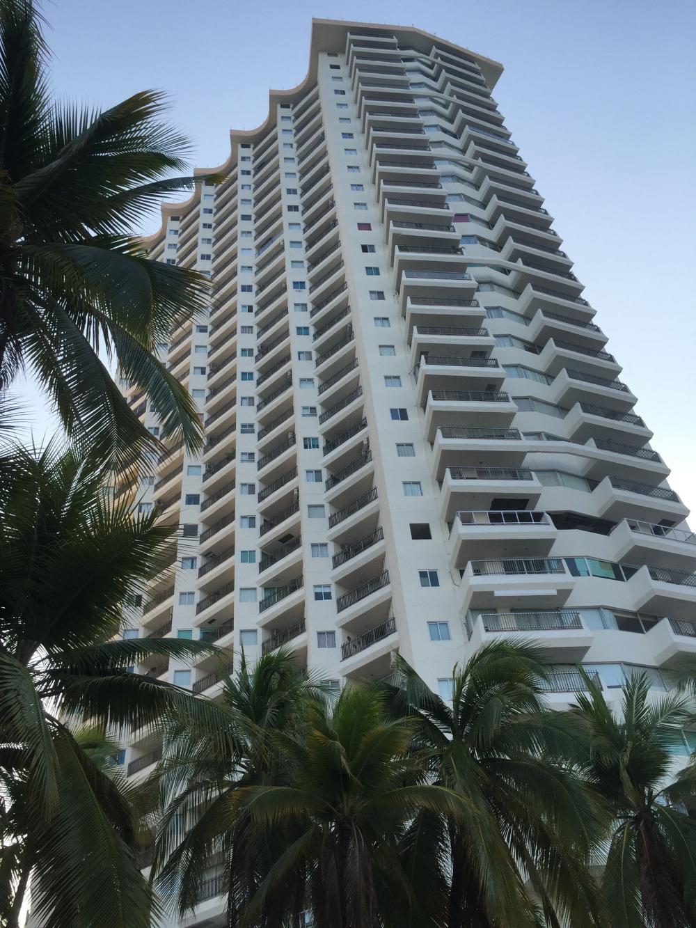 View of La Palapa Acapulco condo tower from the pool area