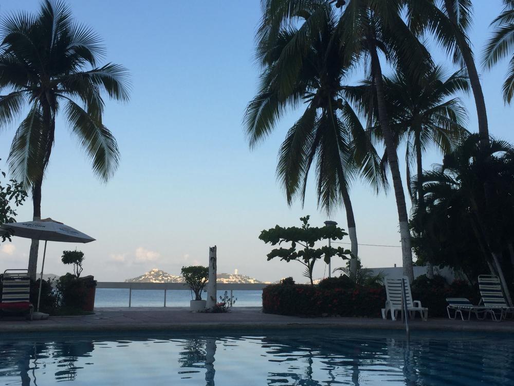 Pool area at La Palapa Acapulco at sunset