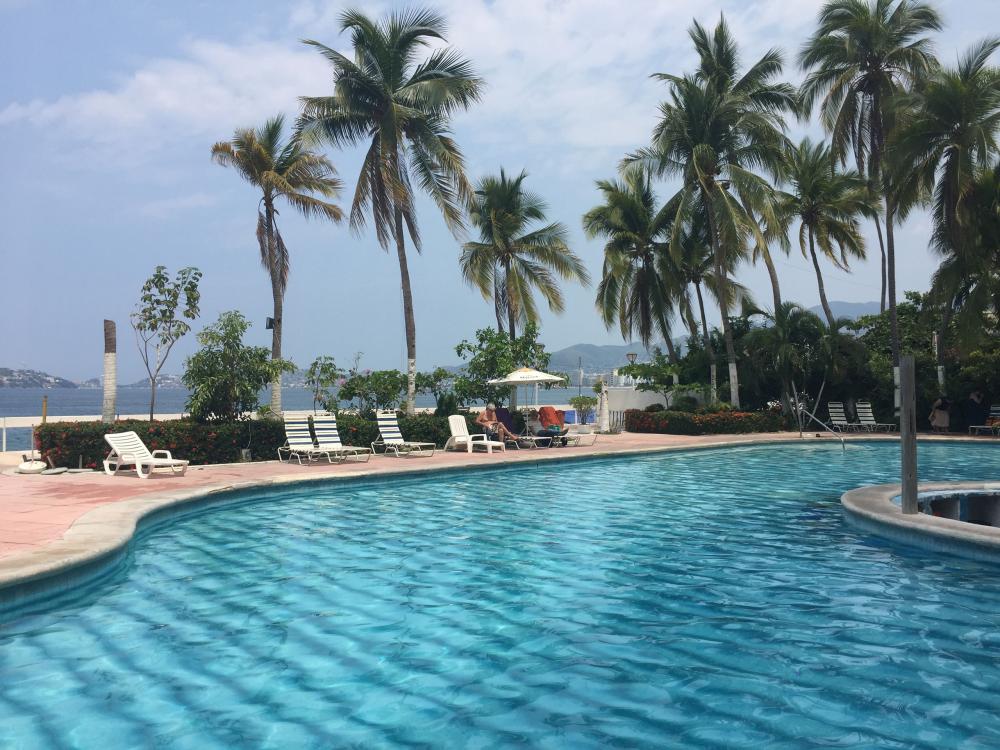 View of the pool at La Palapa with Acapulco Bay in the background