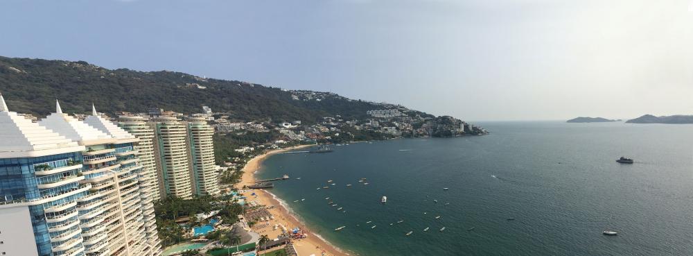 Panorama of Las Brasa and Acapulco Bay from a top floor apartment at La Palapa