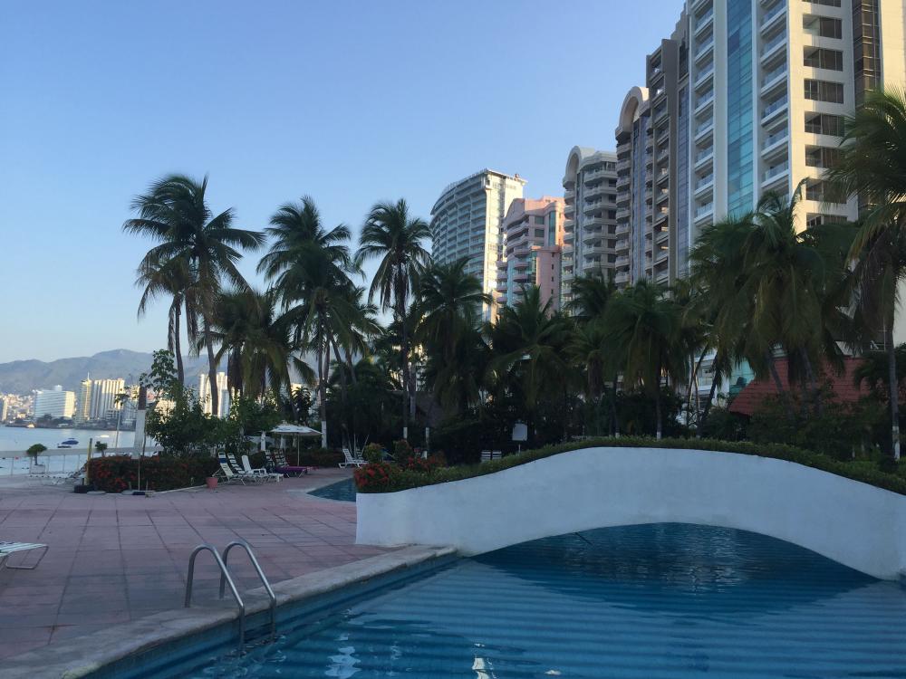 The pool at La Palapa surrounded by luxury condos