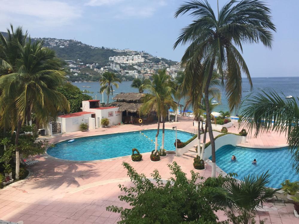 View of the pool and dividing bridge from the mezzanine of La Palapa in Acapulco