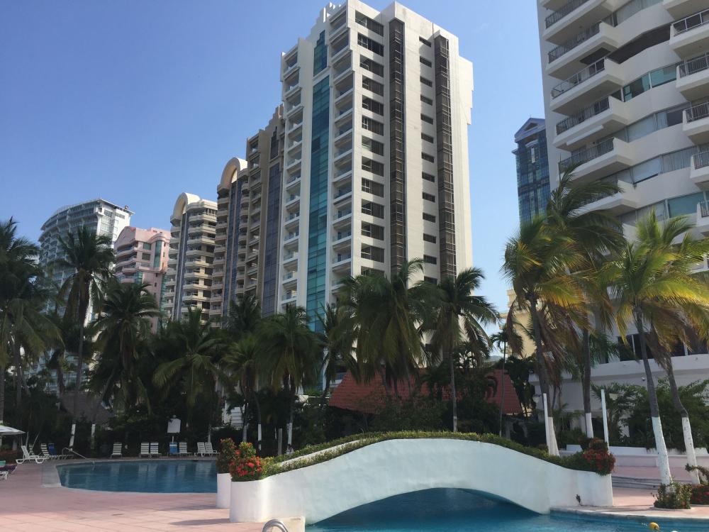 Acapulco's famous skyline with skyscraper hotels from the pool at La Palapa